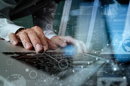 Close up of business man hand working on blank screen laptop computer on wooden desk as concept