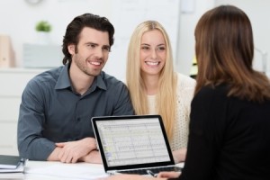 25378670 - young attractive couple during an interview at an office