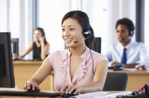42164253 - friendly customer service agent in call centre