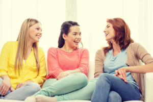 three girlfriends having a talk at home